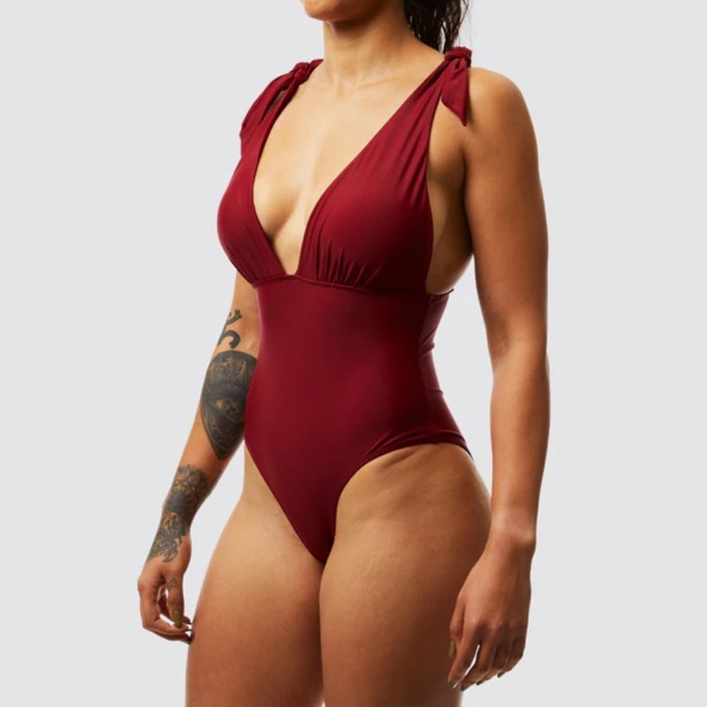 Born primitive oasis one piece swimsuit in burgundy. NWT and liner